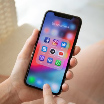 features voip service phonepower mobile app woman holding smartphone in hand